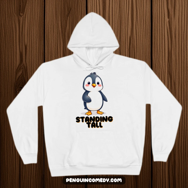 Funny penguin character maintaining perfect balance on one foot, looking serene and focused on this comfortable hoodie.