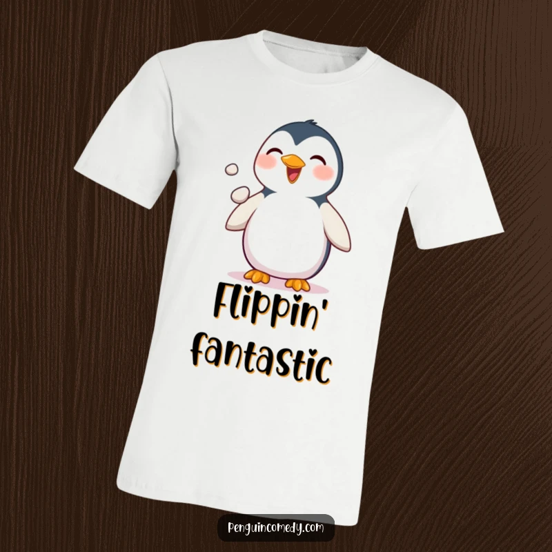 Funny Penguin T-Shirt: A delighted penguin is captured mid-juggle, expertly tossing three small pebbles with its flippers in a joyful display.