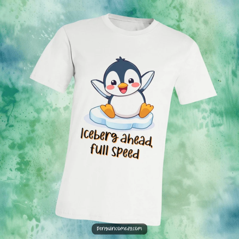 Funny t-shirt showcasing a gleeful penguin comically sliding headfirst on its belly down a smooth, icy slope.