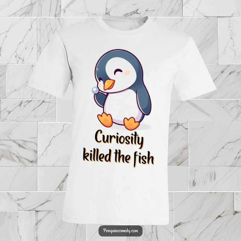 Funny penguin t-shirt, curious bird gazing with head tilted at a gleaming shiny object, expressing fascination and wonder.