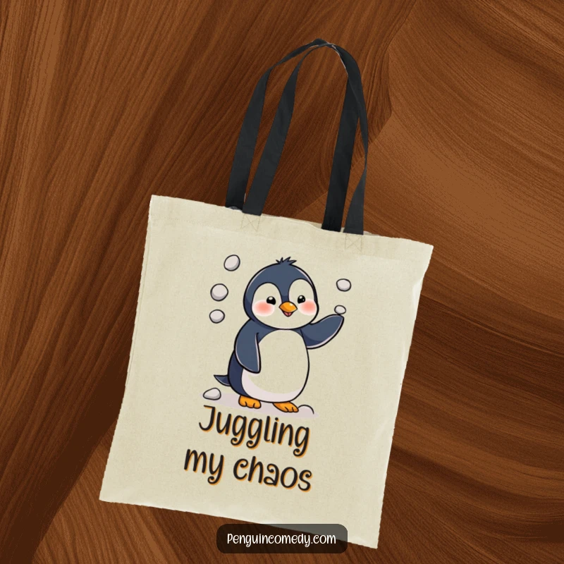 Funny penguin character hilariously juggling three small pebbles, showcasing its charming clumsiness on this practical tote bag.